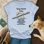 Light blue t-shirt with "Dog Park Day" and a dog carrying a large stick.