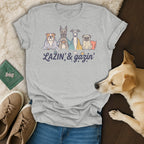 Grey t-shirt with illustrated dogs and the text "LAZIN' & gazin'".
