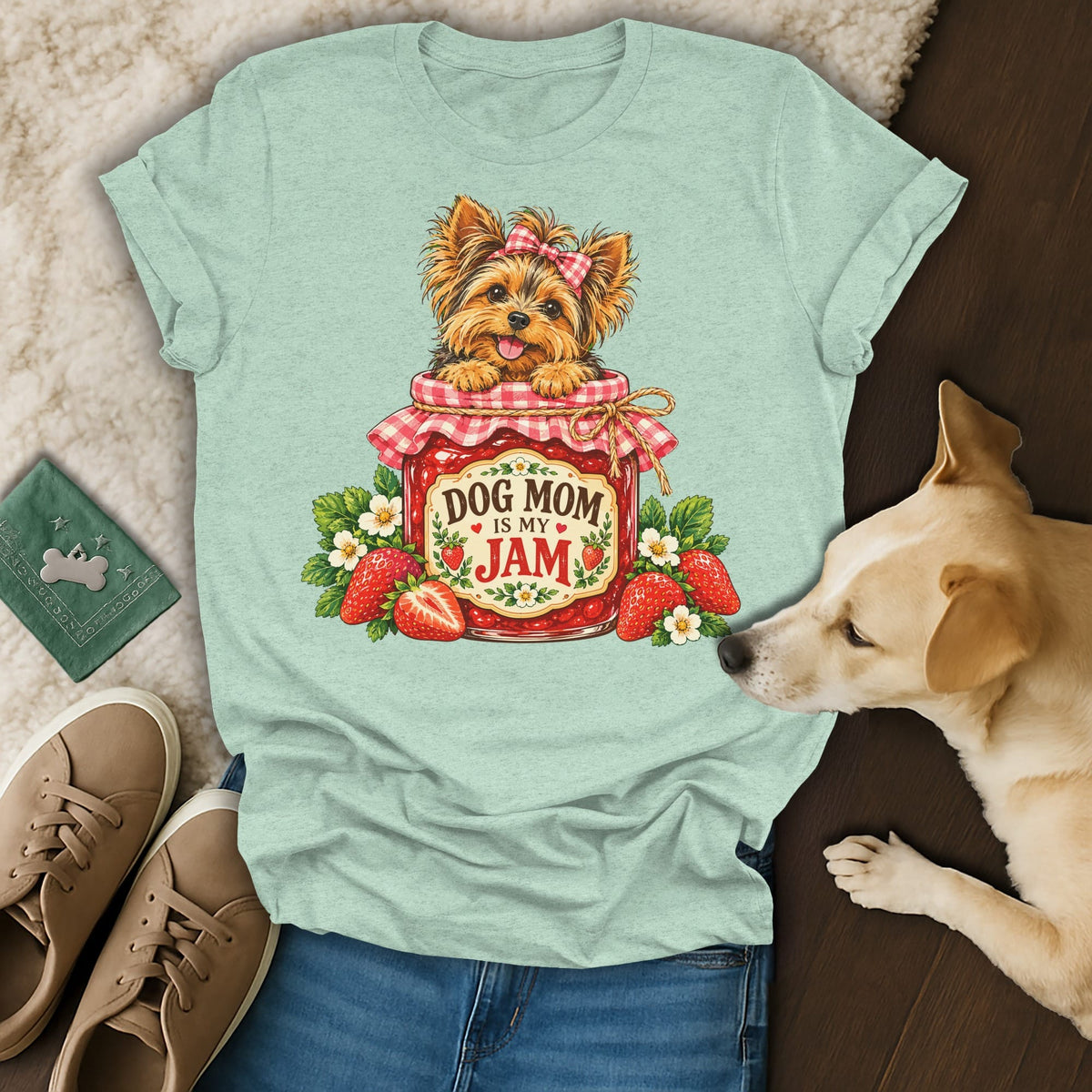 Light green t-shirt with a graphic of a Yorkie in a strawberry jam jar that reads Dog Mom Is My Jam.