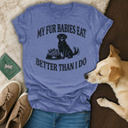 Blue t-shirt with black text and a dog, reads "My Fur Babies Eat Better Than I Do".