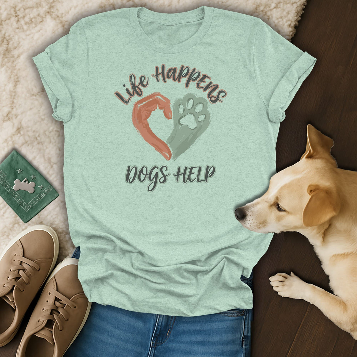 Light green t-shirt with "Life Happens Dogs Help" text and a heart made of a hand and paw.