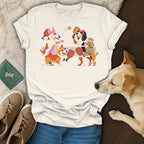 Cream t-shirt with a graphic of dogs playing pickleball and a golden labrador.