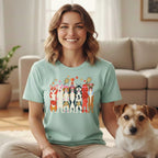 Mint green t-shirt with cartoon dogs playing pickleball and wearing athletic gear.