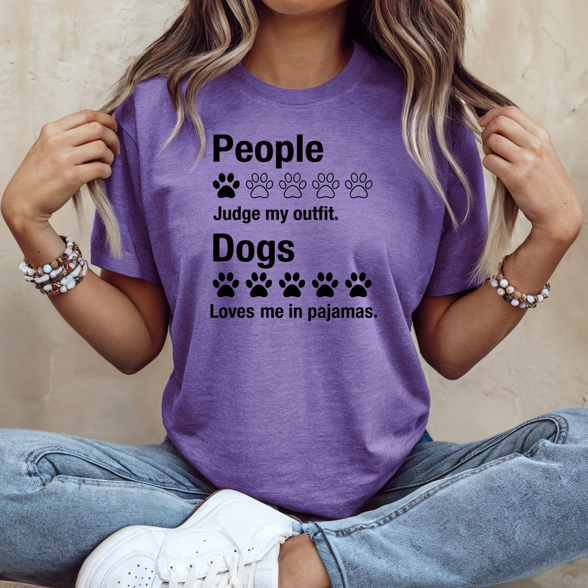 Purple t-shirt with text: "People Judge my outfit. Dogs Loves me in pajamas."