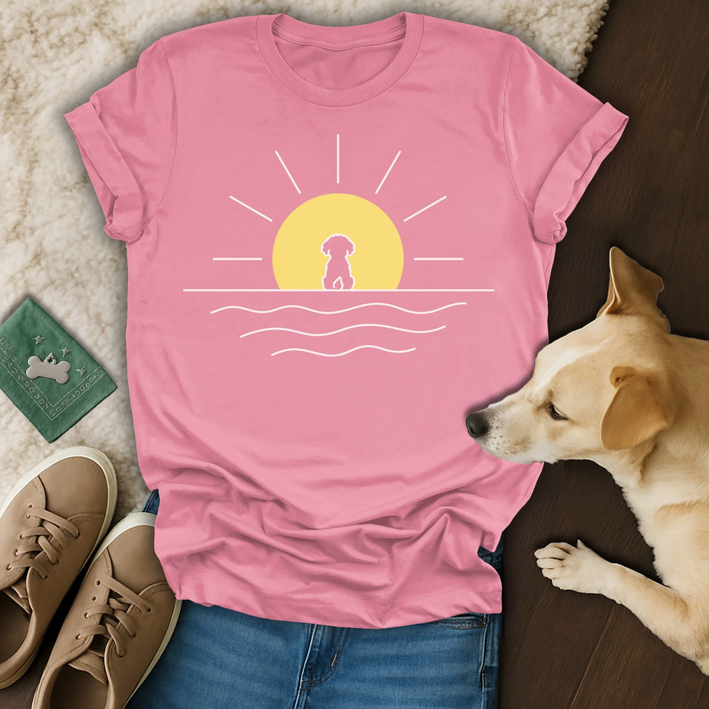 Pink t-shirt with a minimalist dog and sun design.