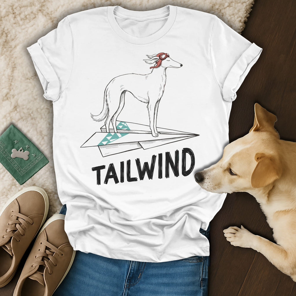 White t-shirt with a dog on a paper airplane and the word "TAILWIND".