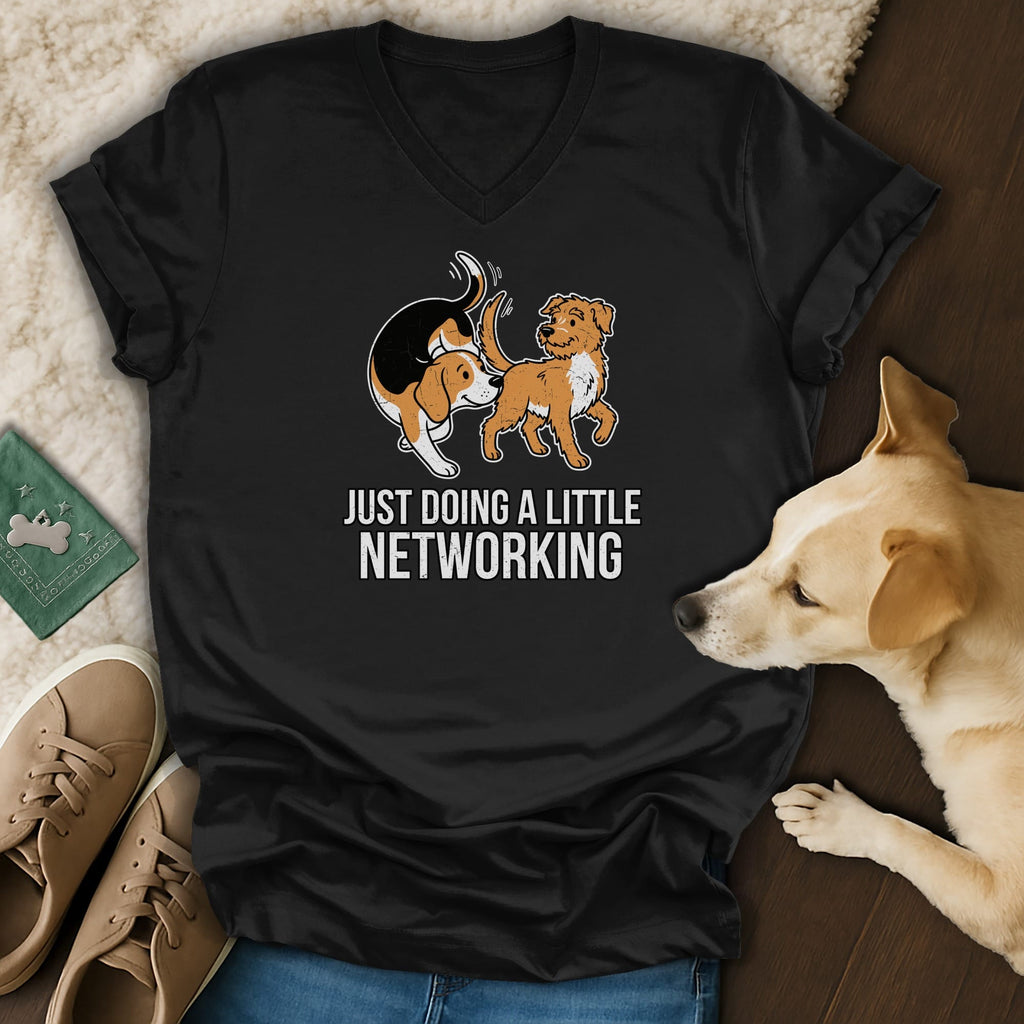 Black v-neck t-shirt with cartoon dogs and text "JUST DOING A LITTLE NETWORKING".