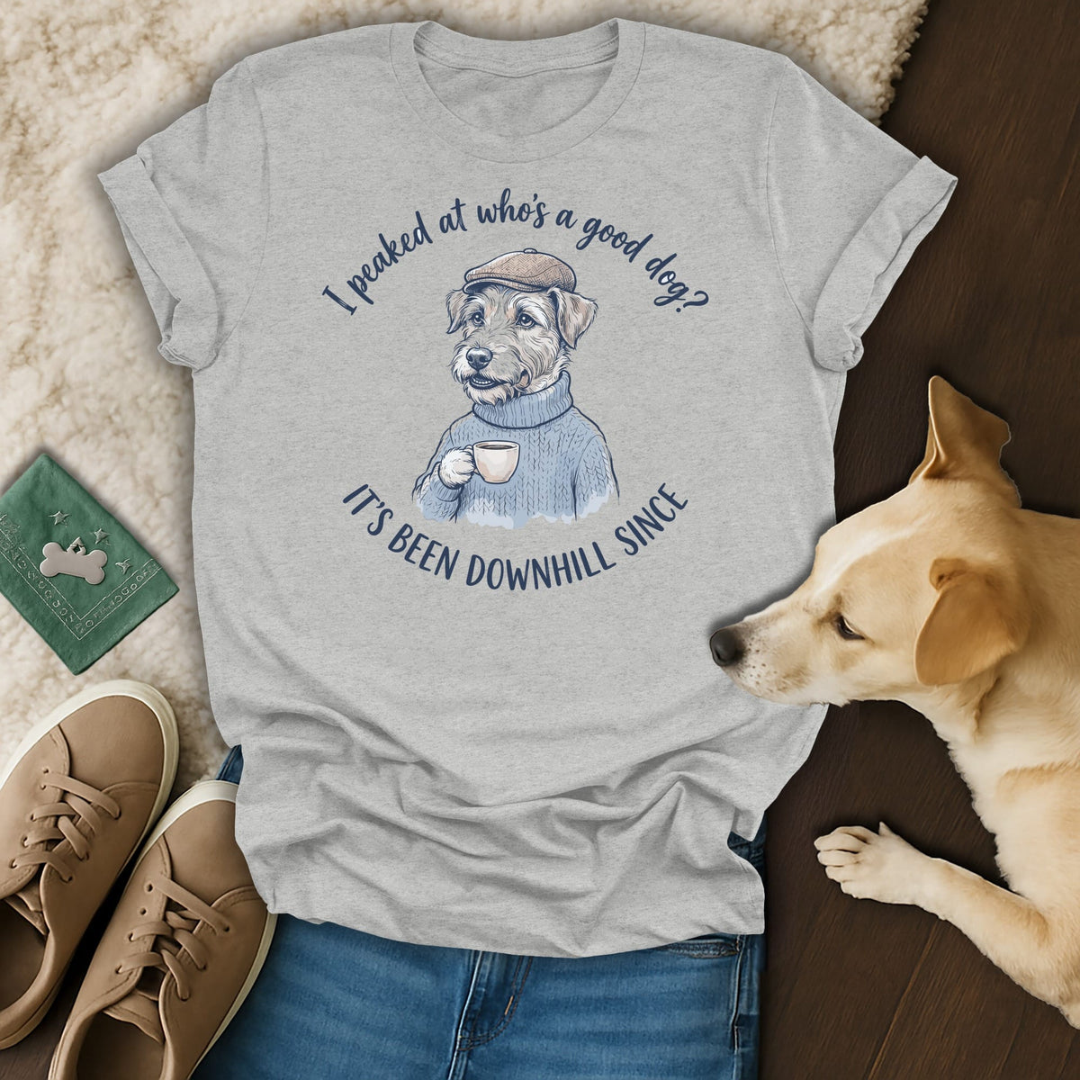 Grey t-shirt with illustration of dog in sweater and cap drinking coffee.