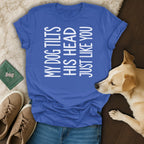 Blue t-shirt with white text "MY DOG TILTS HIS HEAD JUST LIKE YOU"