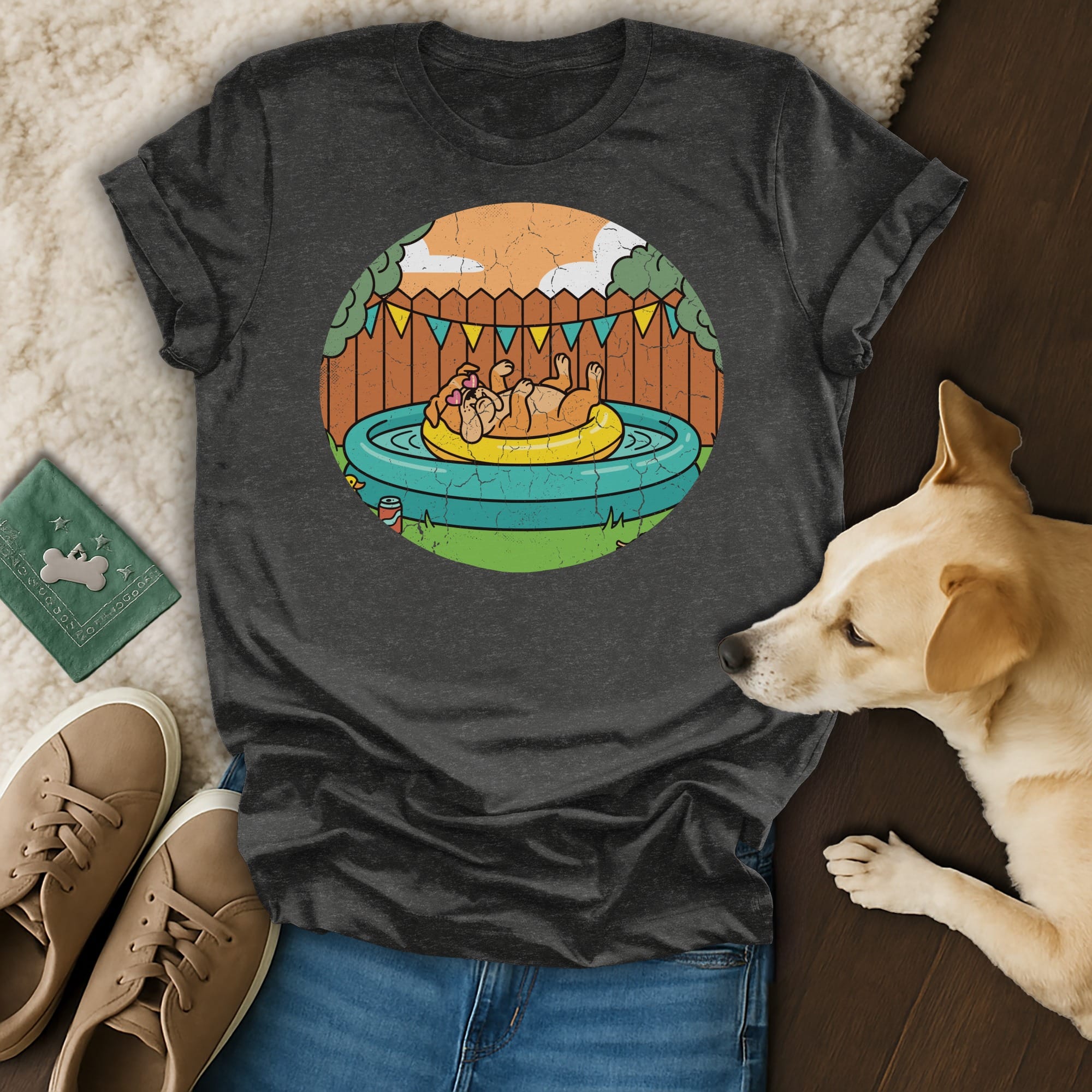 Dark grey t-shirt with graphic of dog relaxing in kiddie pool.