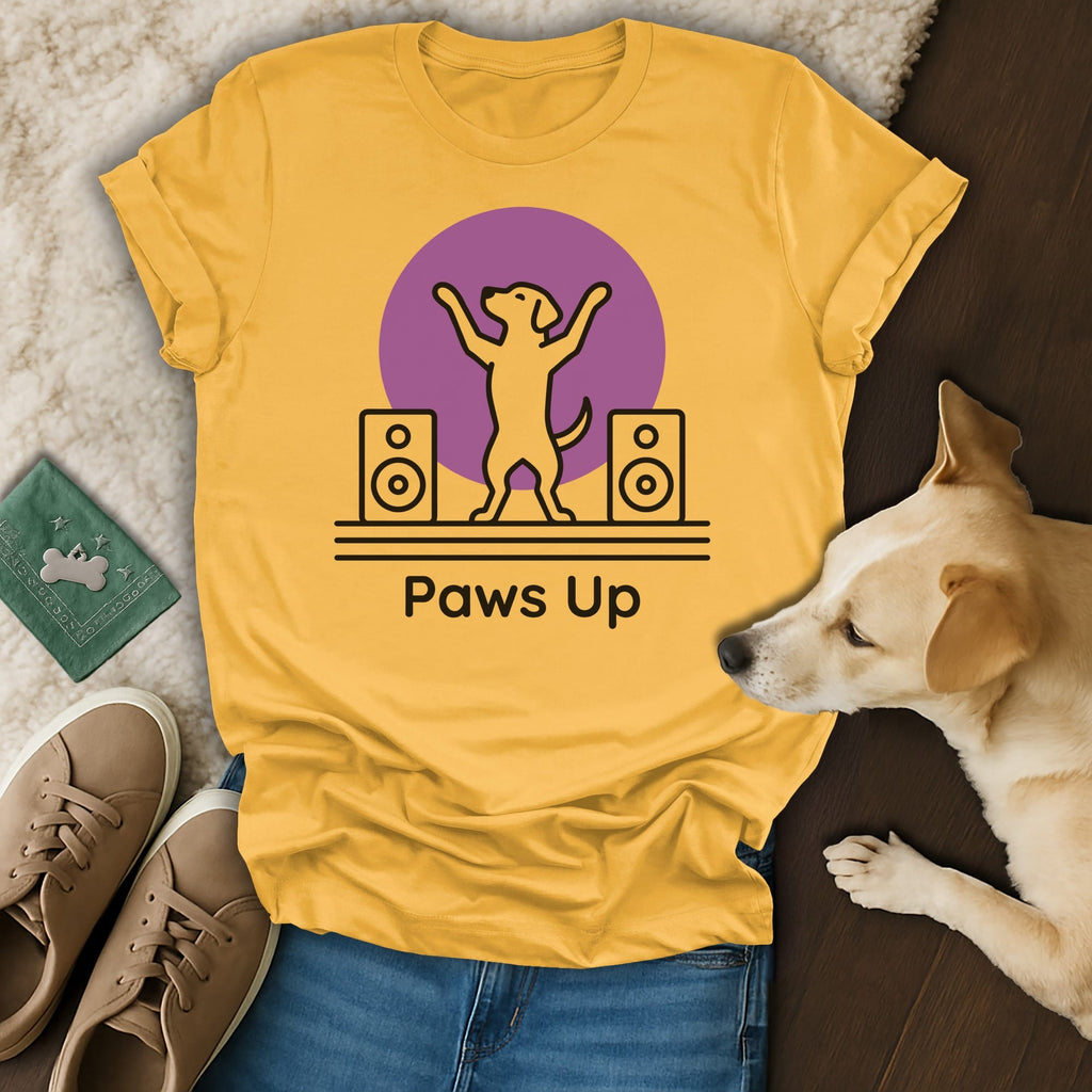 Yellow t-shirt with "Paws Up" text, two speakers, and a dog silhouette.
