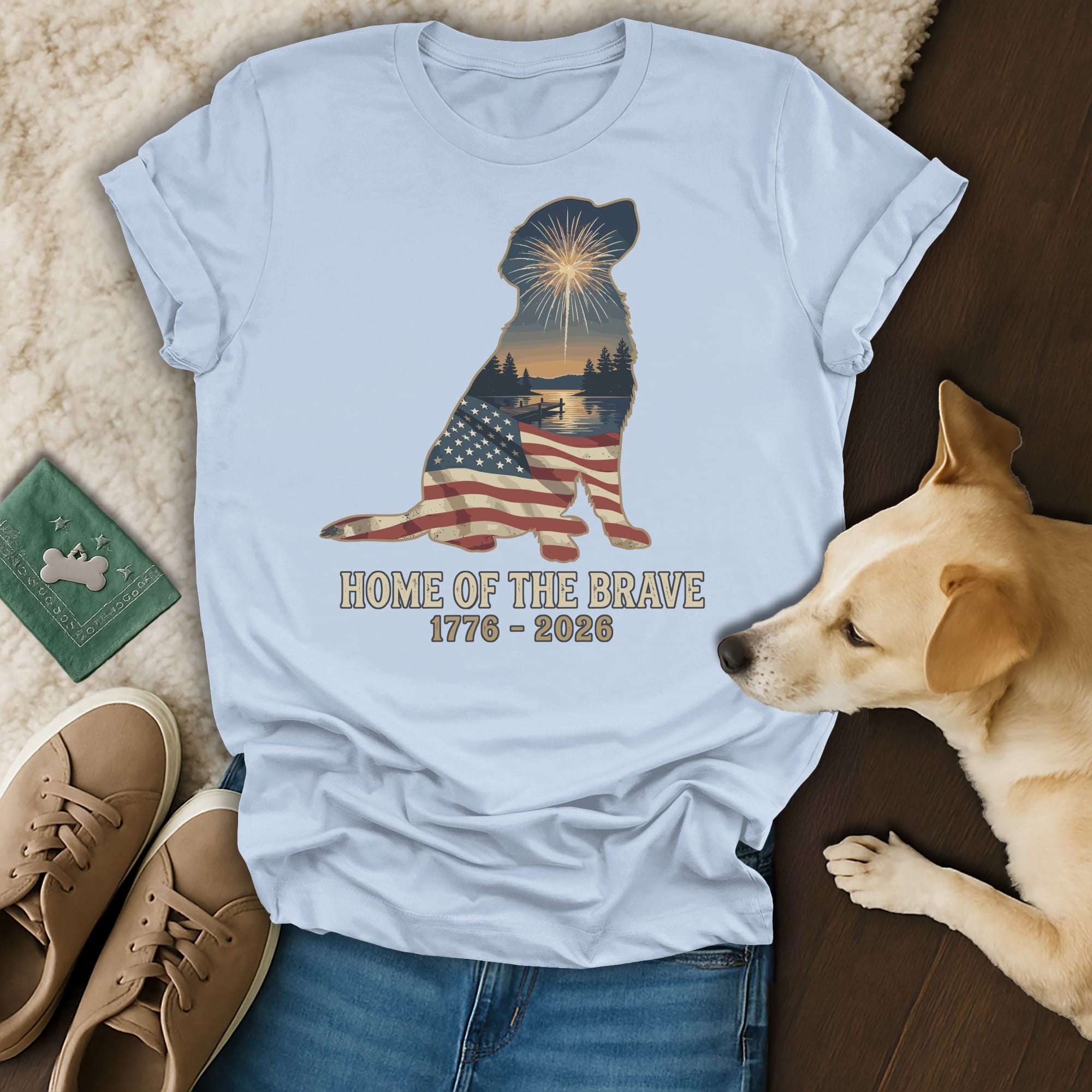Light blue t-shirt with patriotic dog silhouette and "Home of the Brave 1776 - 2026" text.