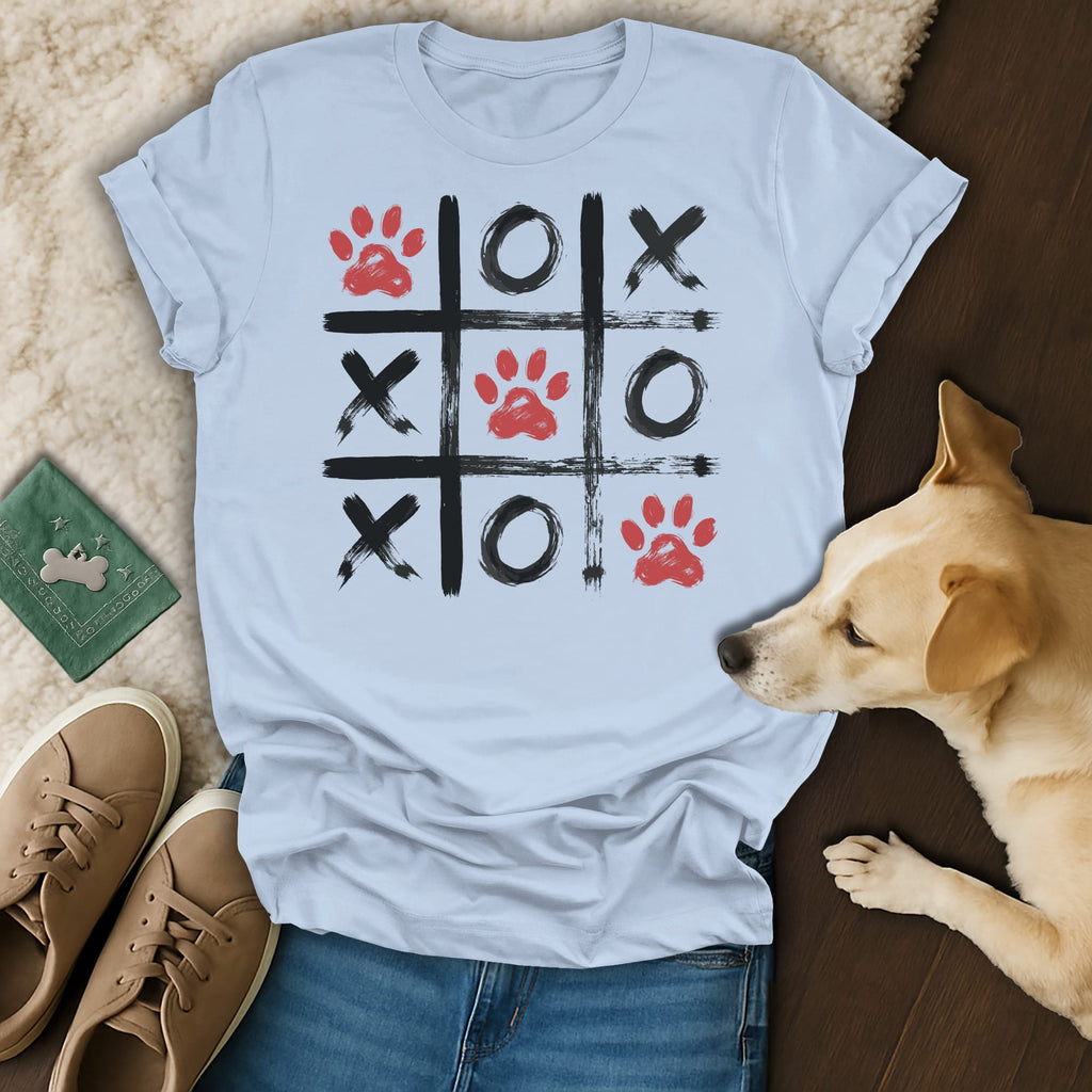 Light blue t-shirt with a tic-tac-toe grid featuring red paw prints and black X's and O's.