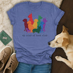 Blue t-shirt with colorful dog illustrations and "my kind of book club" text.