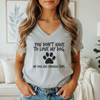 Light grey v-neck t-shirt with black text and a paw print.