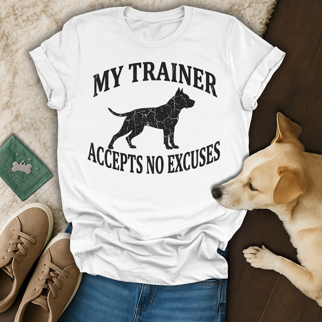 White t-shirt with black dog silhouette and text "MY TRAINER ACCEPTS NO EXCUSES."