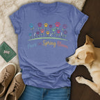 Blue t-shirt with "Paws in Spring Bloom" text and flower paw prints.