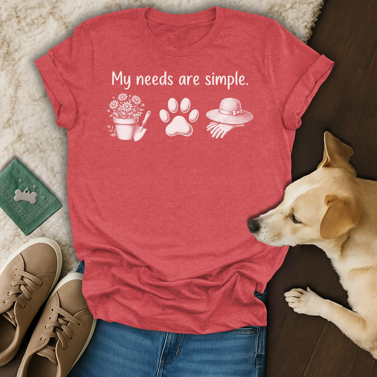 Red t-shirt with "My needs are simple" text and gardening, paw print, and hat graphics.