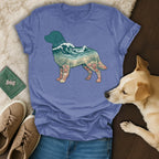 T-shirt with a dog silhouette filled with ocean waves, sand, and shells.