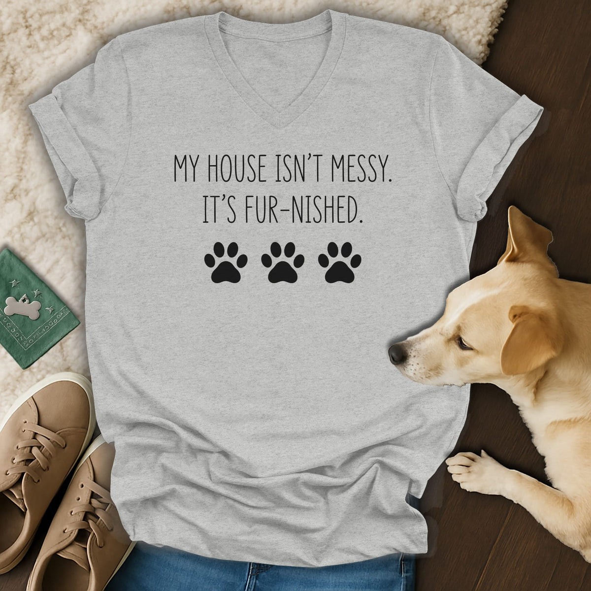 Light grey t-shirt with "My house isn't messy. It's fur-nished." and paw prints.