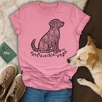 Pink t-shirt with a stylized dog silhouette filled with heart shapes.