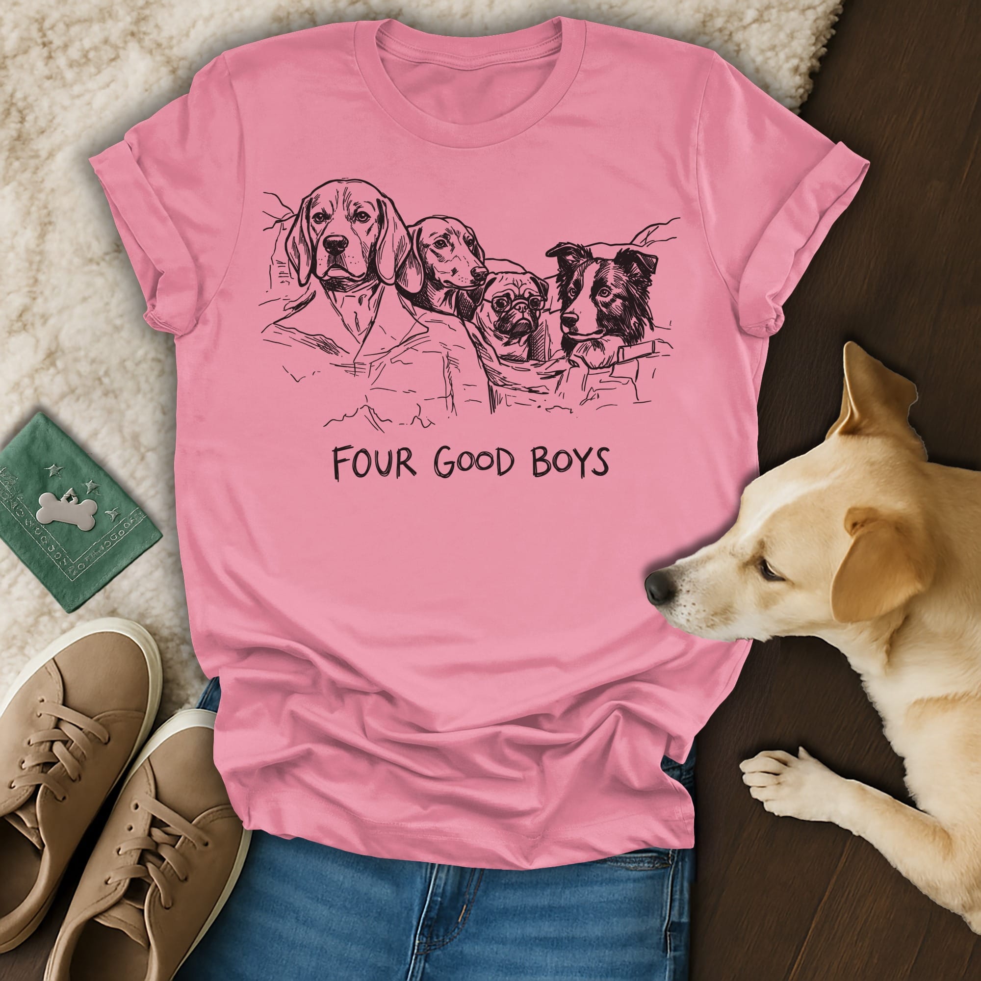 Pink t-shirt with line drawing of four dogs and "FOUR GOOD BOYS" text.