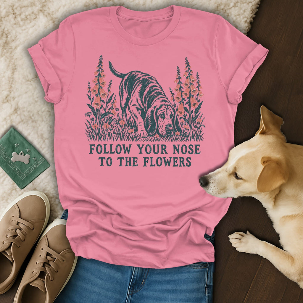 Pink t-shirt with a basset hound graphic, flowers, and the text Follow Your Nose to the Flowers.