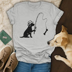Dog wearing a hat fishing for a bone with a fishing rod.