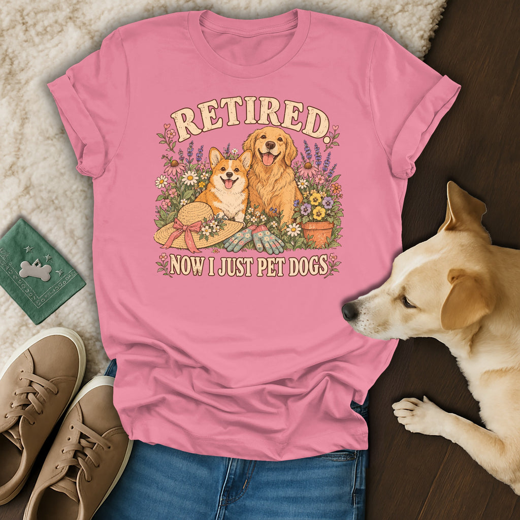Pink t-shirt with a vintage graphic of two dogs, flowers, and the text Retired Now I Just Pet Dogs.