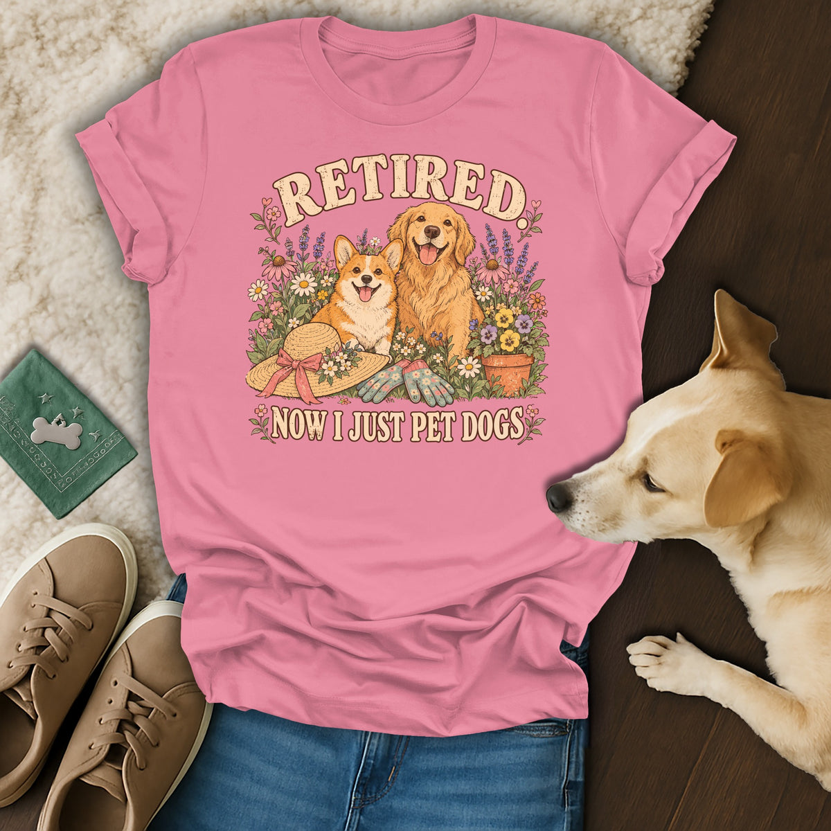 Pink t-shirt with a vintage graphic of two dogs, flowers, and the text Retired Now I Just Pet Dogs.
