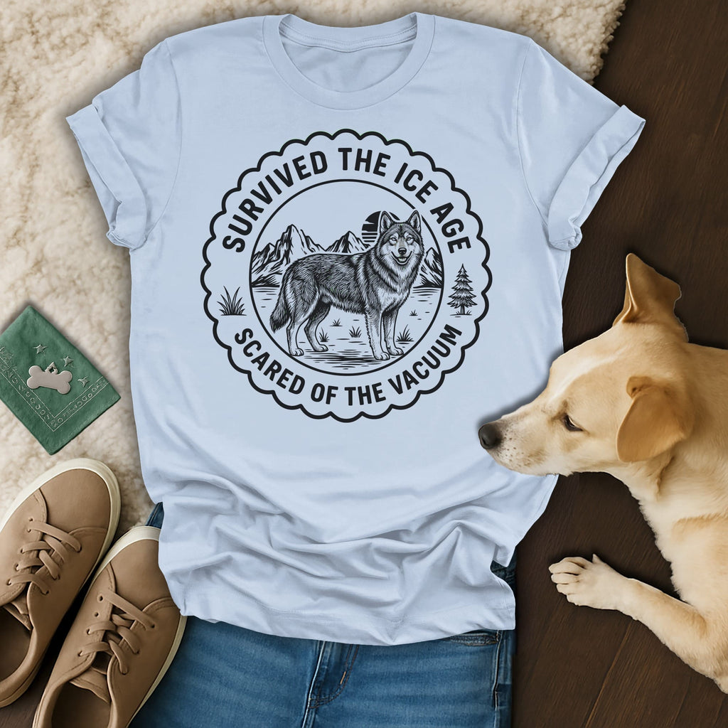 Light blue t-shirt with "Survived the Ice Age, Scared of the Vacuum" graphic of a wolf.