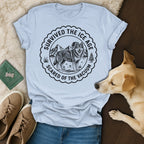 Light blue t-shirt with "Survived the Ice Age, Scared of the Vacuum" graphic of a wolf.