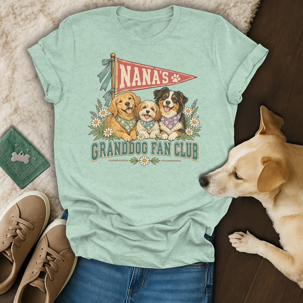 Light green t-shirt with a Nana's Granddog Fan Club graphic featuring three dogs, surrounded by shoes and a real dog.