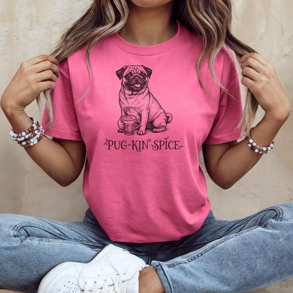 Pink t-shirt with a black line drawing of a pug holding a cup of coffee and the text "Pug-Kin Spice".