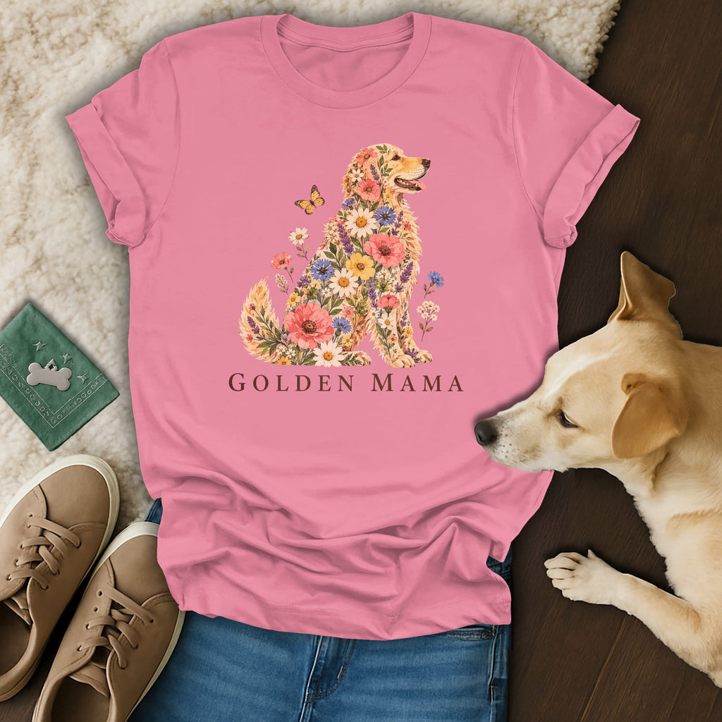 Pink crewneck t-shirt featuring a golden retriever made of flowers and the text GOLDEN MAMA, laid out with blue jeans, tan sneakers, and a real dog.