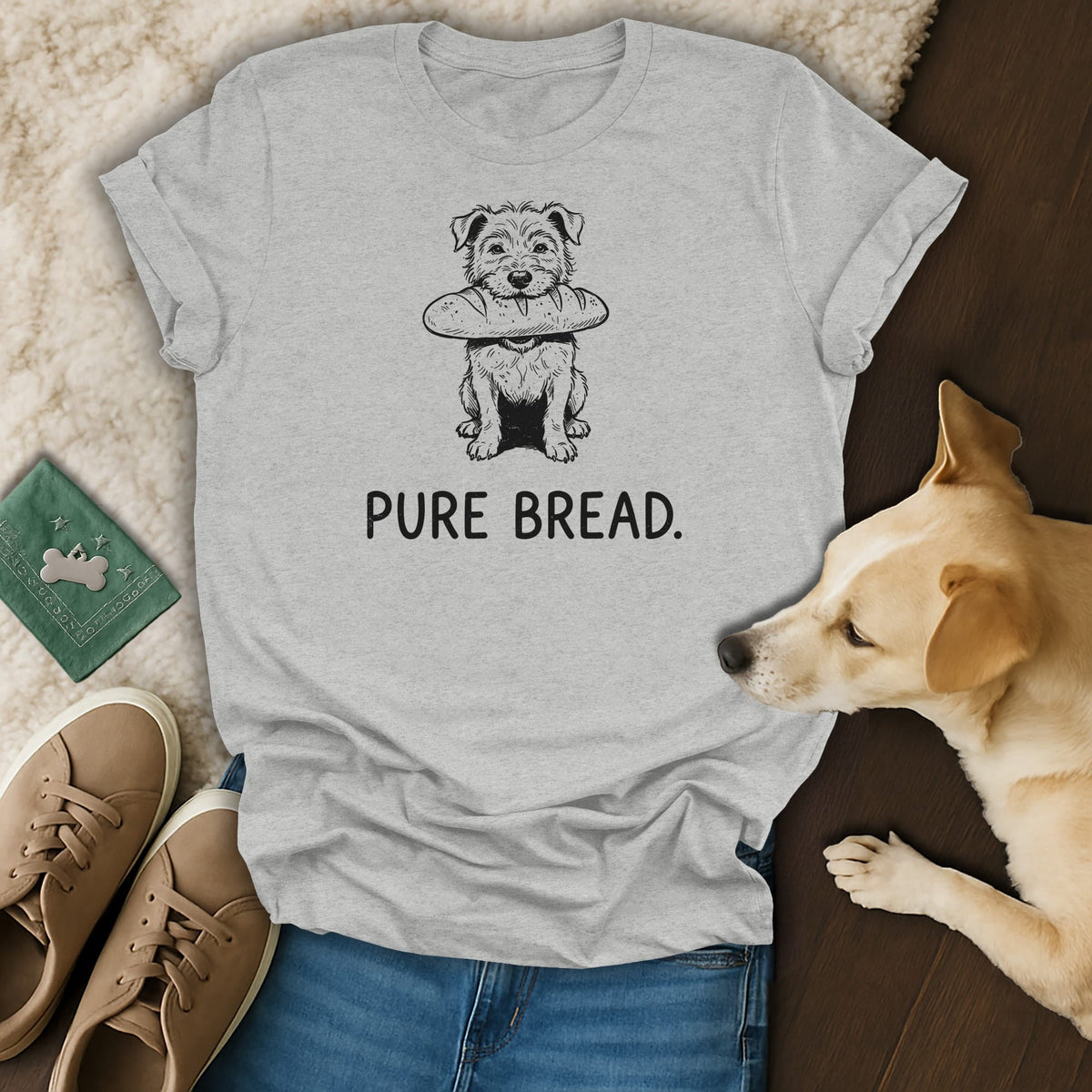 Grey t-shirt with a drawing of a dog holding a loaf of bread and the text "PURE BREAD.".