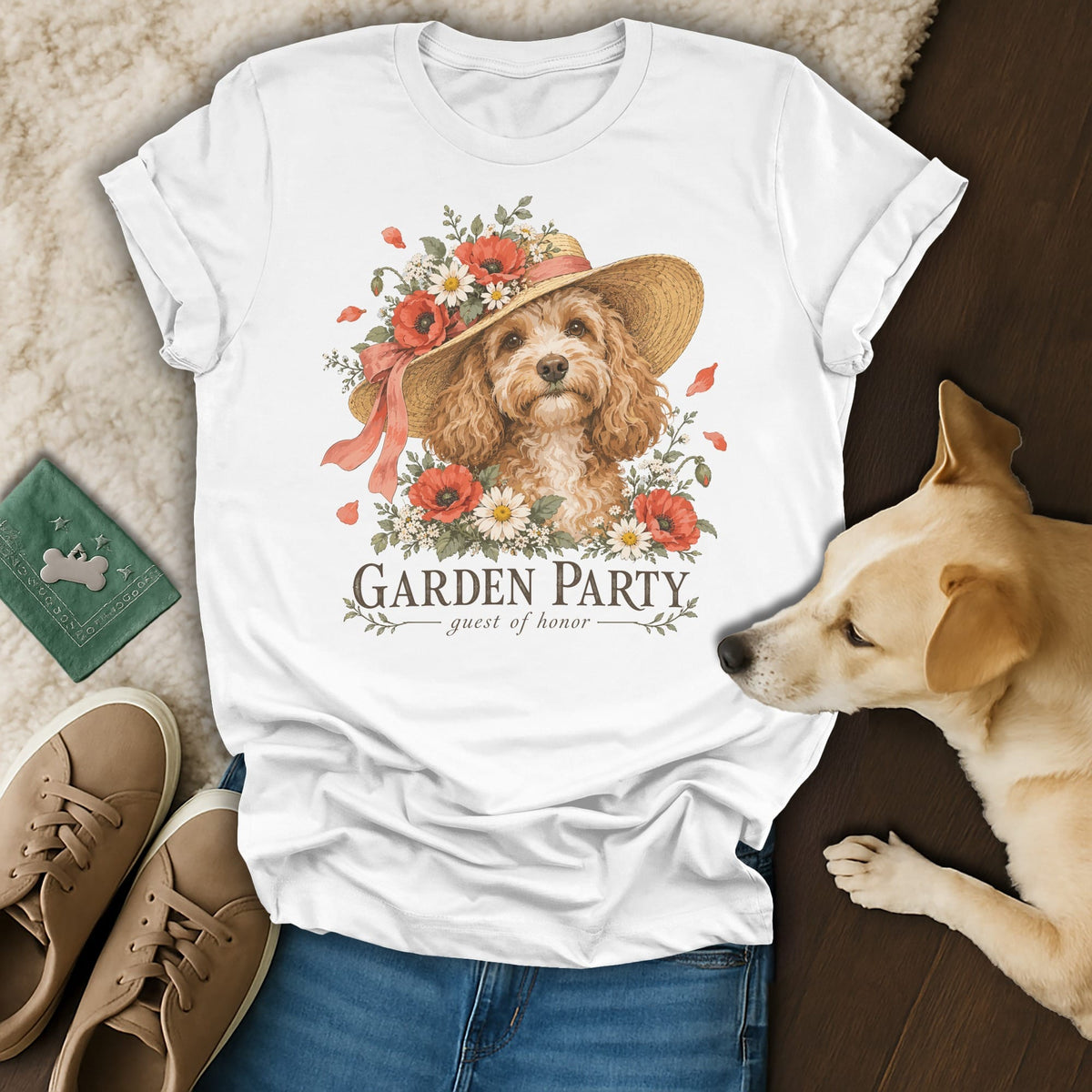 A white t-shirt featuring a watercolor graphic of a poodle wearing a floral sun hat.