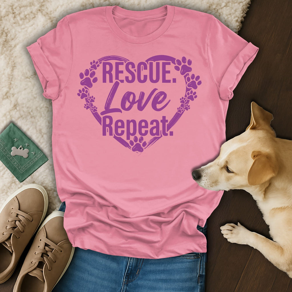 Pink t-shirt with "Rescue Love Repeat" and paw prints in heart.