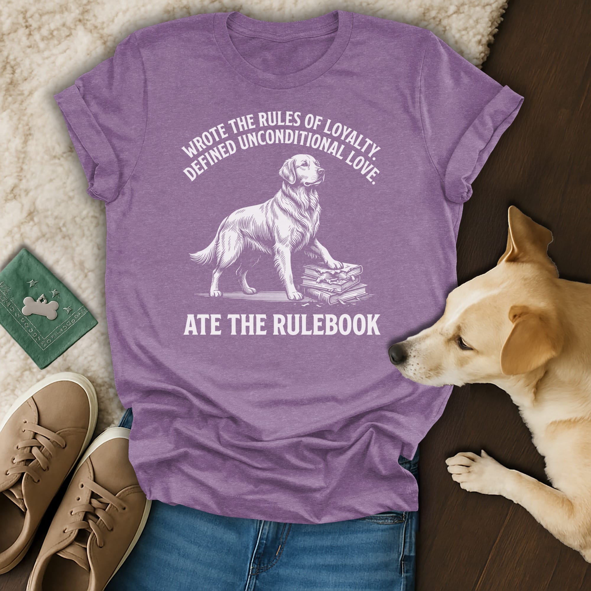 T-shirt with dog graphic and text: "Wrote the rules of loyalty. Defined unconditional love. Ate the rulebook."