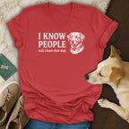 Red v-neck t-shirt with "I KNOW PEOPLE well, I know their dogs" and a dog illustration.