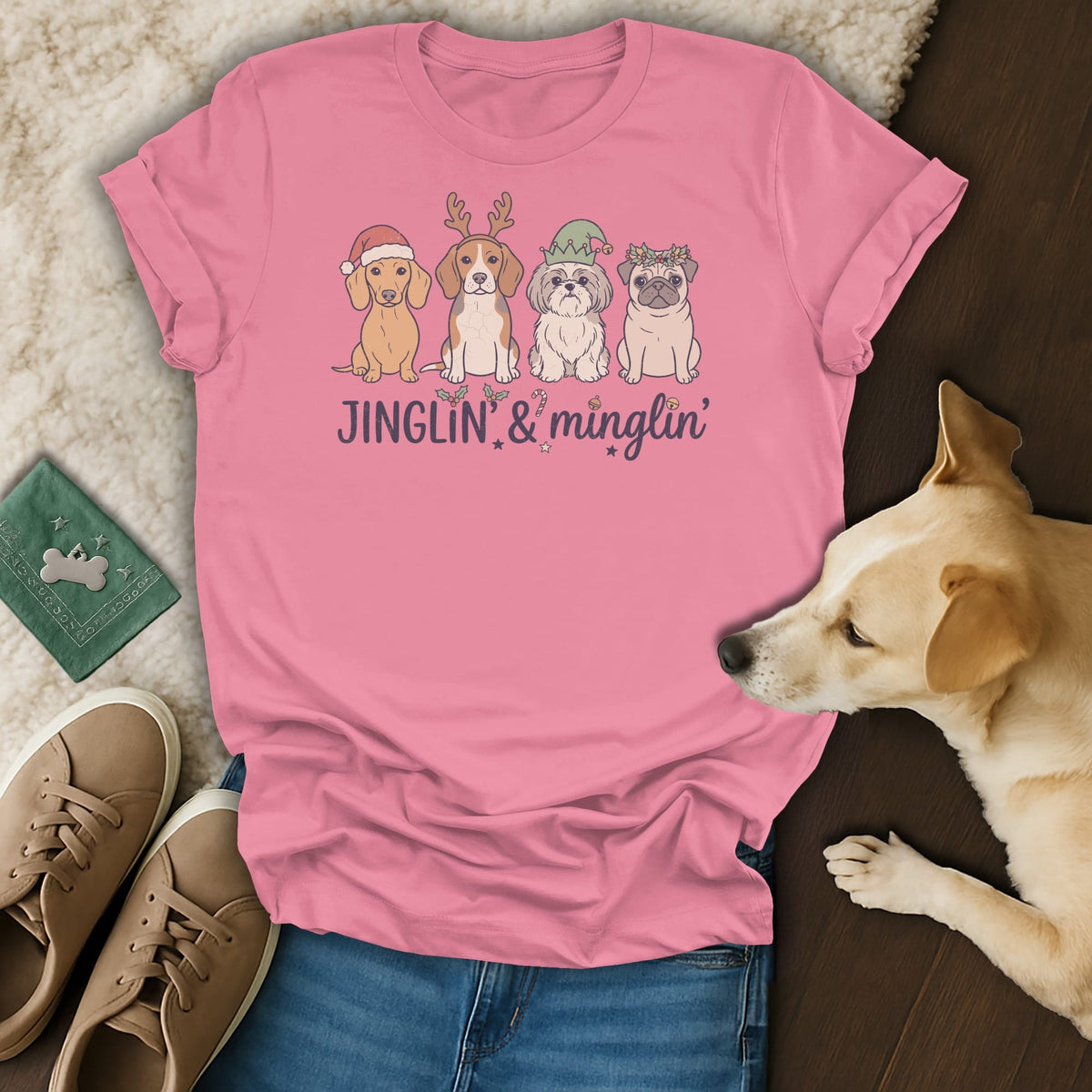 Pink t-shirt with four festive dogs and text "JINGLIN' & minglin'".