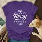 Purple t-shirt with "Talk Furry To Me" text and paw prints.