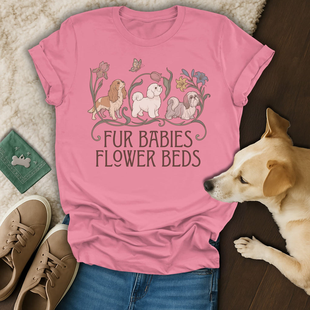 Pink t-shirt with a graphic of three dogs and flowers, bearing the text "FUR BABIES FLOWER BEDS".