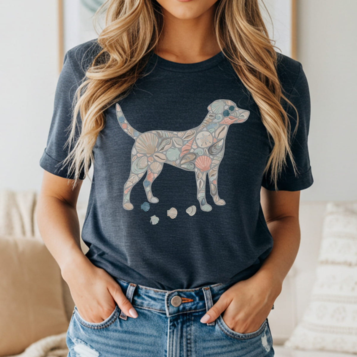 Dog silhouette filled with seashells and sand dollars on a dark t-shirt.