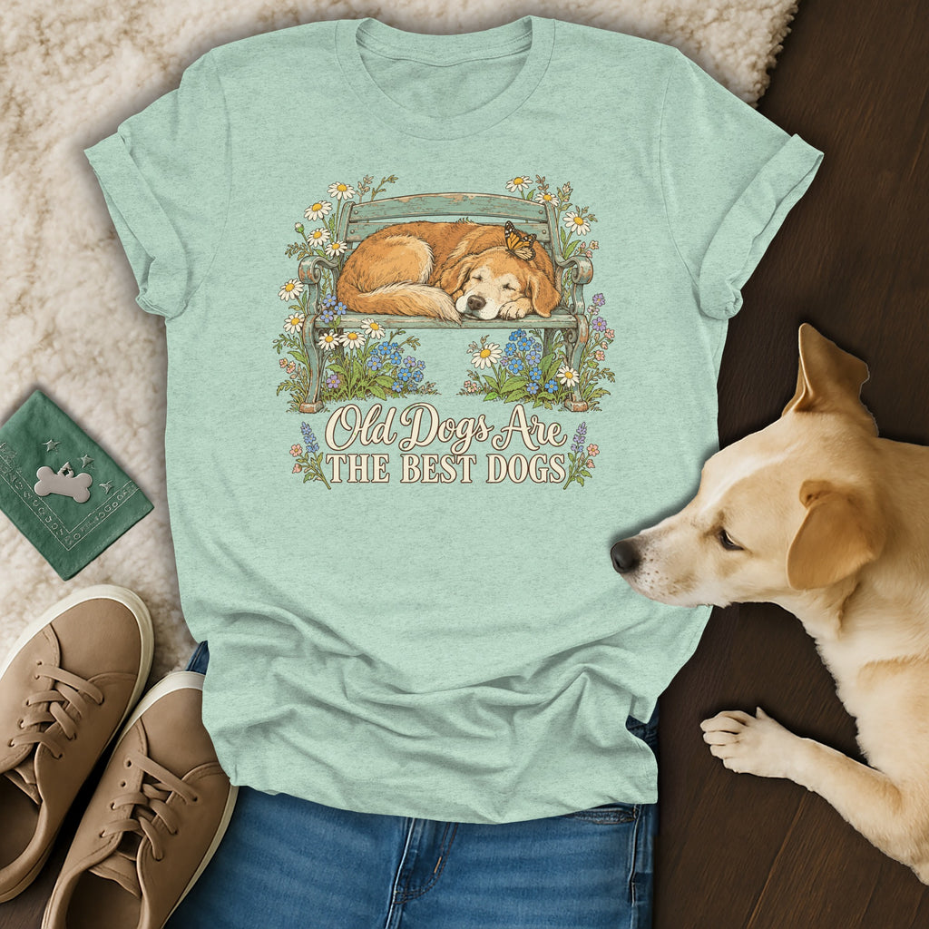 Mint green t-shirt featuring a graphic of a sleeping dog on a bench and the text Old Dogs Are The Best Dogs.