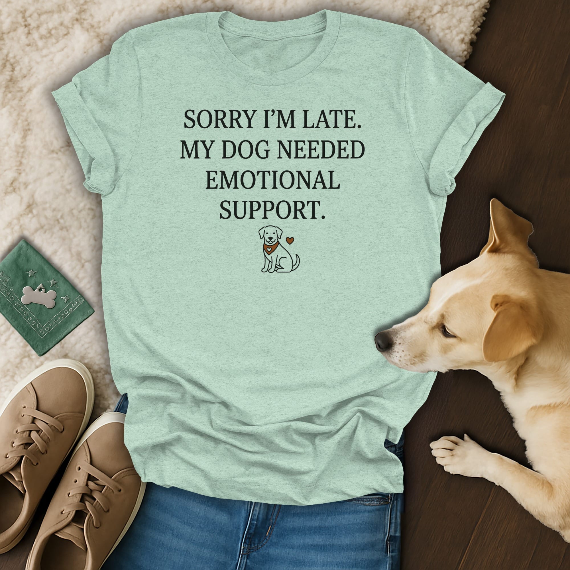 Light blue t-shirt with text "SORRY I'M LATE. MY DOG NEEDED EMOTIONAL SUPPORT." and dog illustration.