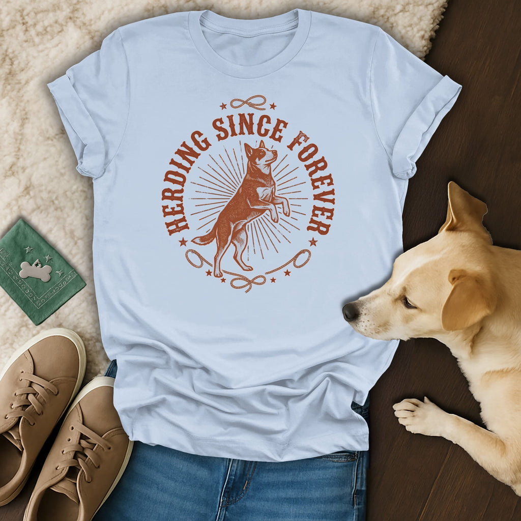 Light blue t-shirt with "Herding Since Forever" and a dog silhouette.