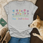 Gray t-shirt with "Paws & Smell the Roses" text and floral paw prints.