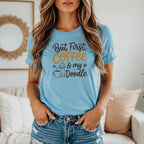 Light blue t-shirt with "But First, Coffee & my Doodle" text and doodle illustration.
