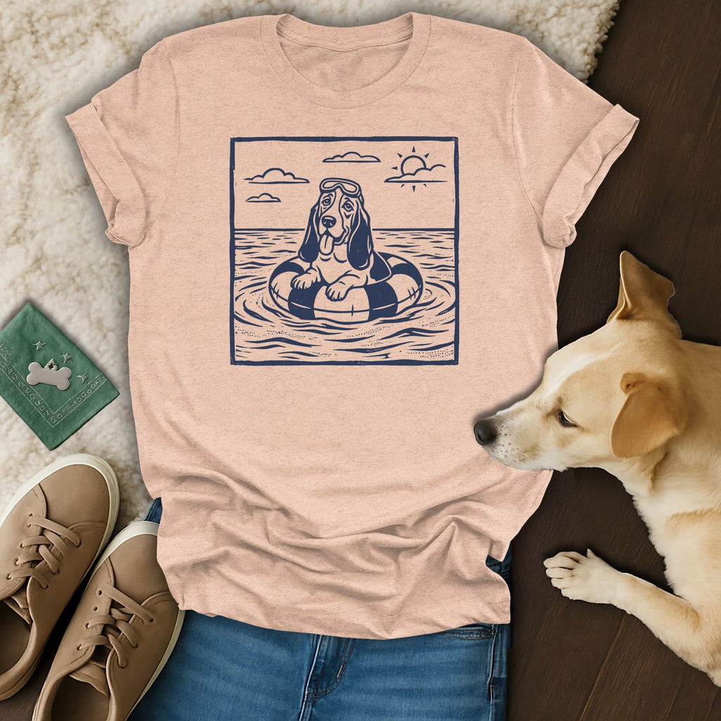 Basset hound wearing goggles floats on a tube in water with sun.